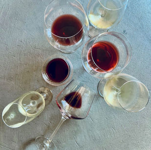 various wine glasses filled with wine