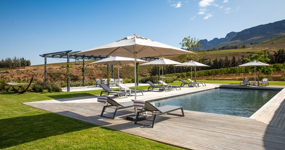 outdoor pool area with umbrellas