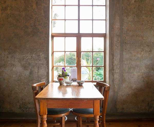 table and chairs by window