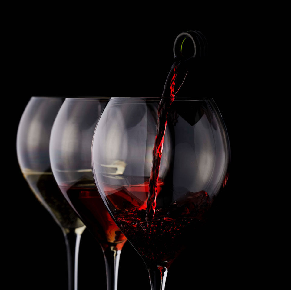 pouring red wine into glass