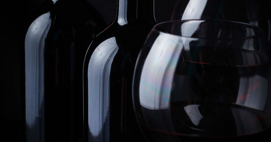 red wine bottles and glass