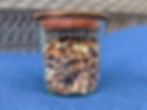 A jar of dried dandelion roots.