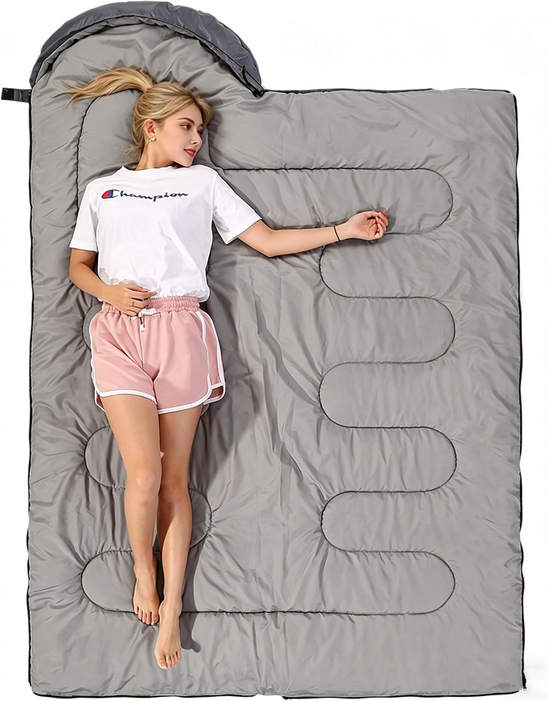 Thumbnail: Woman resting in spacious grey sleeping bag