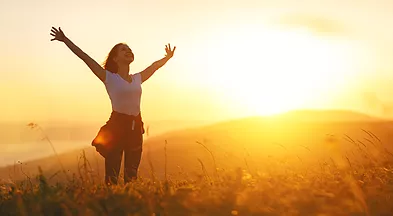 Happy woman on the sunset in nature in.webp