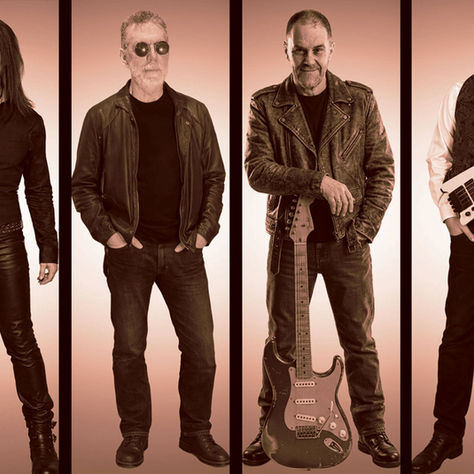 Four rock musicians pose in sepia-toned studio panels, one with drumsticks, one in sunglasses, one with guitar, one with bass.