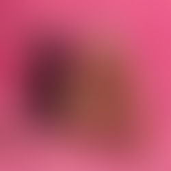 Woman with long blonde hair holding a sparkly microphone, lying on pink furry carpet. Purple electric guitar nearby. Mood is glamorous.