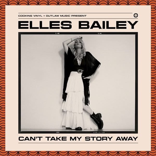 Singer poses with arm on head, wearing a black top and white skirt against a plain wall. Text: "Elles Bailey - Can't Take My Story Away."