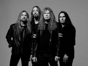 Four men with long hair and serious expressions in black leather jackets pose against a plain gray background. Black and white image.