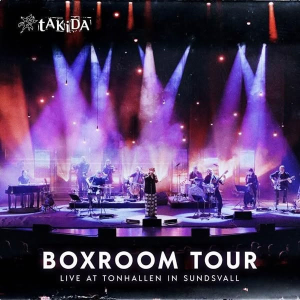 Band performing on stage with colorful lights. Text reads "Takida, Boxroom Tour, Live at Tonhallen in Sundsvall." Vibrant, energetic scene.