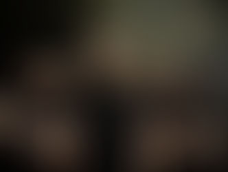 Five serious men stand with arms crossed in a gritty tunnel. "HANGMAN'S CHAIR" text on one shirt. Graffiti on brick walls. Moody atmosphere.