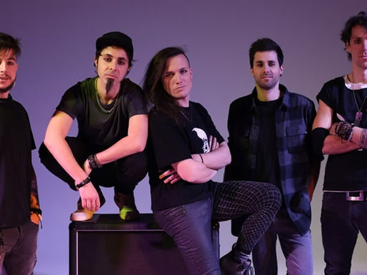 Five men stand confidently in casual black clothes against a purple gradient background. One leans on an amp, creating a relaxed band vibe.