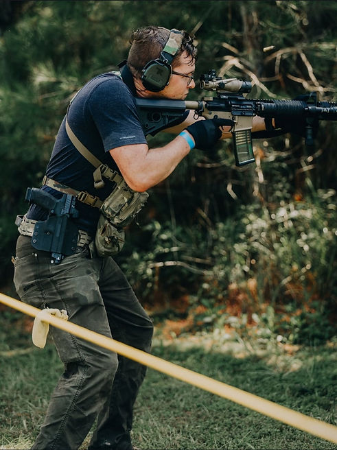 Tagg Rystephanuk aiming downrange at a shooting competition