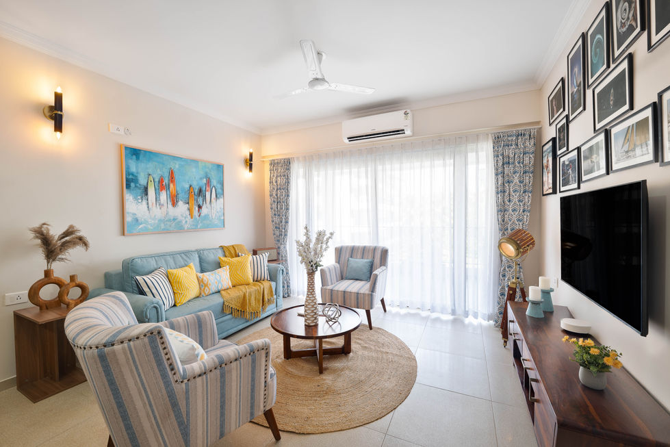 Bright living room with colorful decor and large window.