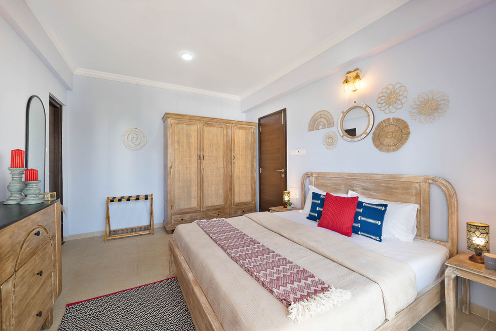 Cozy bedroom with wooden furniture and decorative accents.