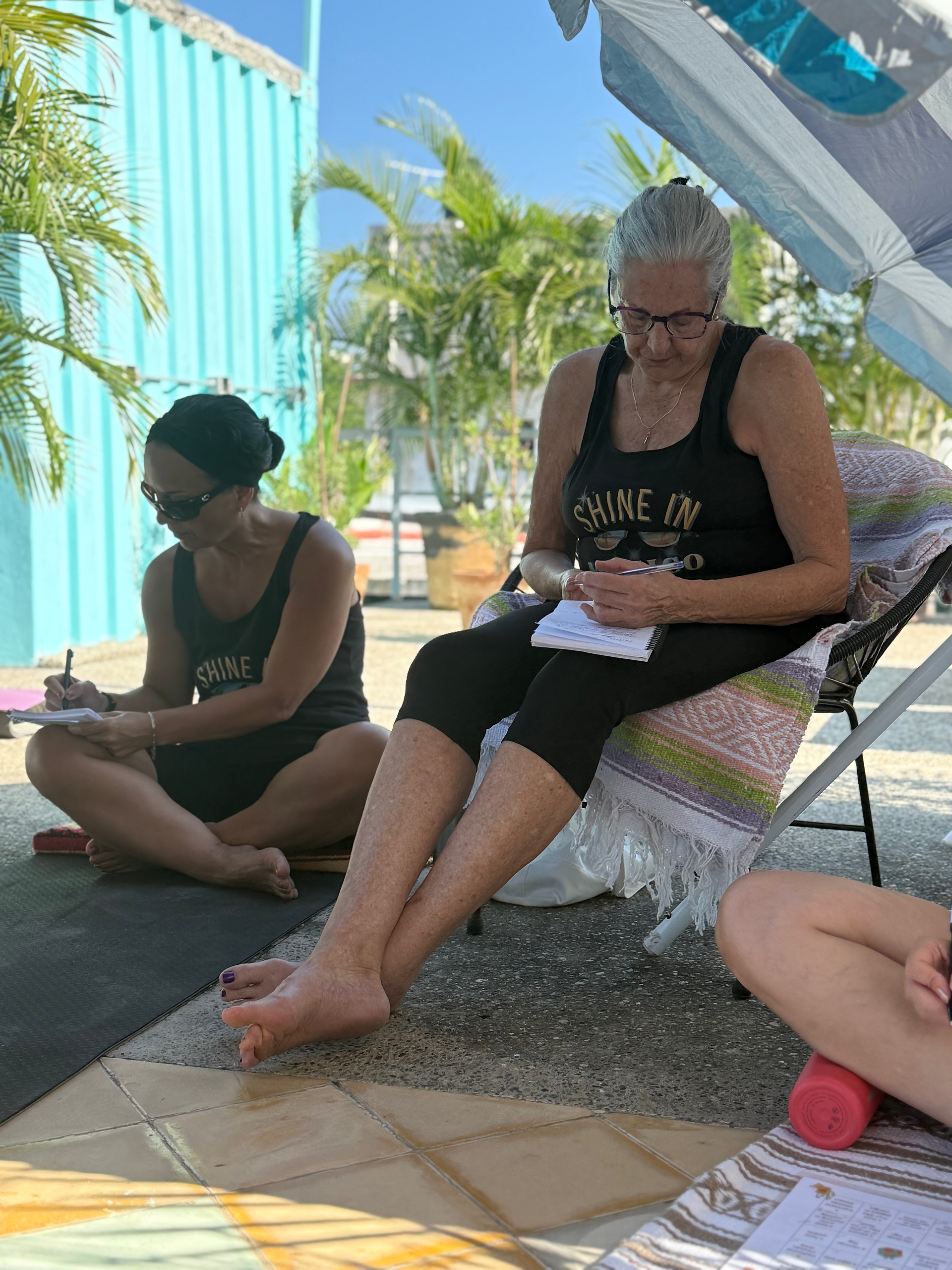 Women journaling in deep reflection.
