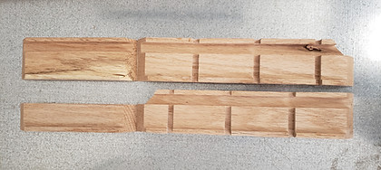 Oak pieces with aligned grooves for the upper compartment walls