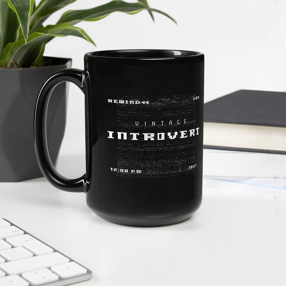15 OZ BLACK MUG WITH RETRO VHS STYLE THAT SAYS VINTAGE INTROVERT