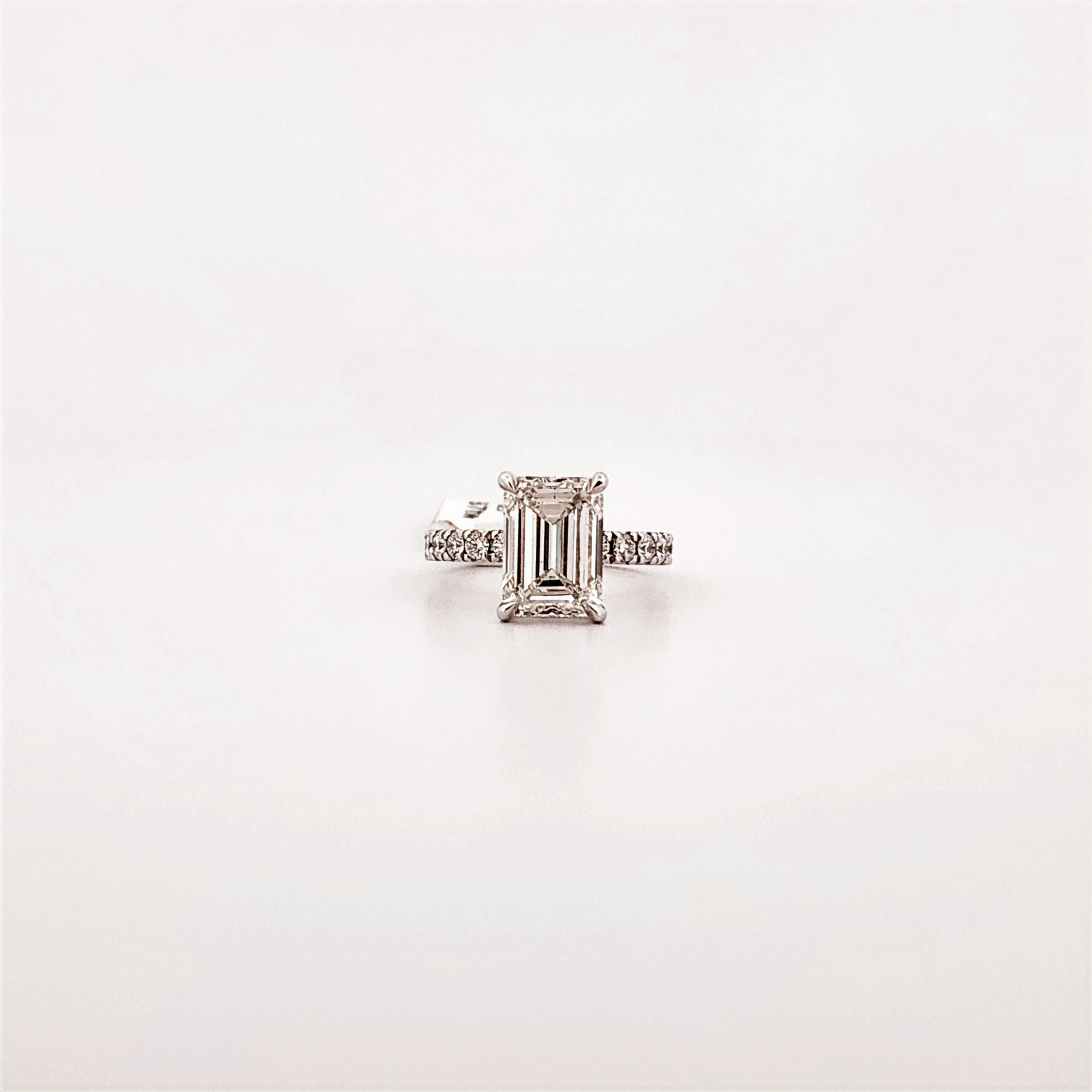 Emerald Cut Engagement Ring with Hidden Halo and Accent Shank