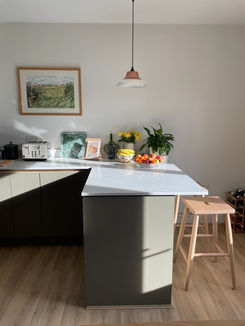 Olive green kitchen with breakfast bar