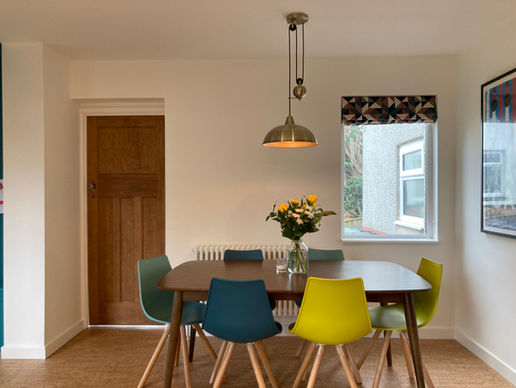 Dining table with colourful chairs