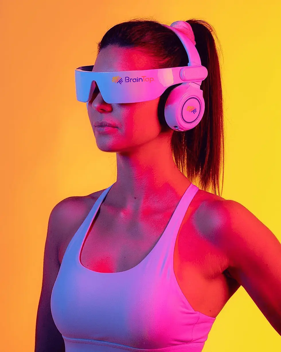 Woman in a white tank top wearing futuristic VR headset and headphones with "BrainTap" text, against a vibrant orange-yellow background.