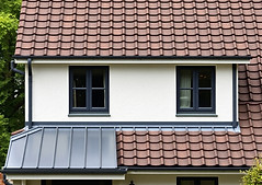 house with roof half tiles and colourbond.jpg