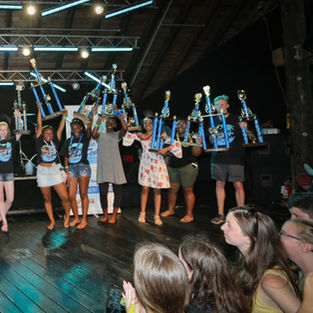 Students cheering together on stage at the festival awards