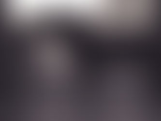 A young woman standing beside a horse in silhouette at a barn doorway, symbolizing balance, harmony, and the study of equine biomechanics in training.