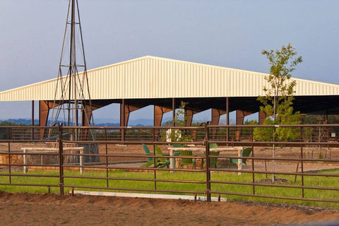 Commercial development red iron weld up horse arena metal building