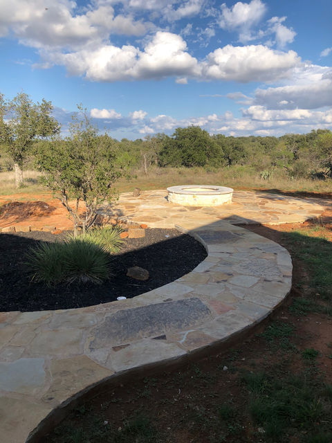 Stone walkway / flatwork leading to firepit on Llano Ranch