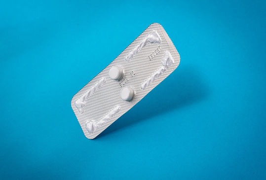 A package of abortion pills on blue background
