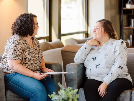 Covenant Care counselor talking with a woman