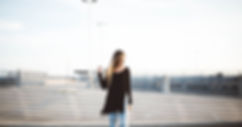 blonde woman on roof of building 