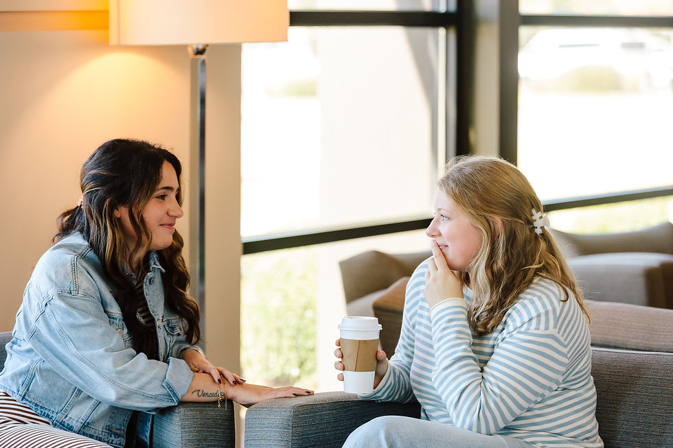 Covenant Care counselor talking to a woman over coffee