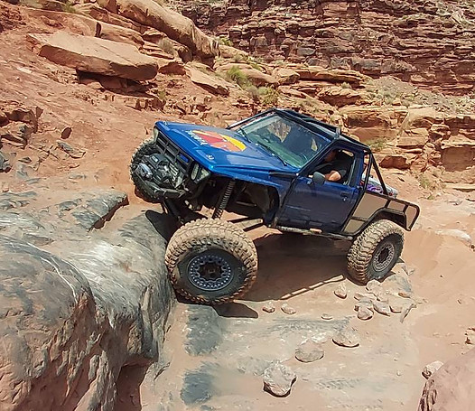 Truck built by J Webs Fab on a Obsticle in Moab