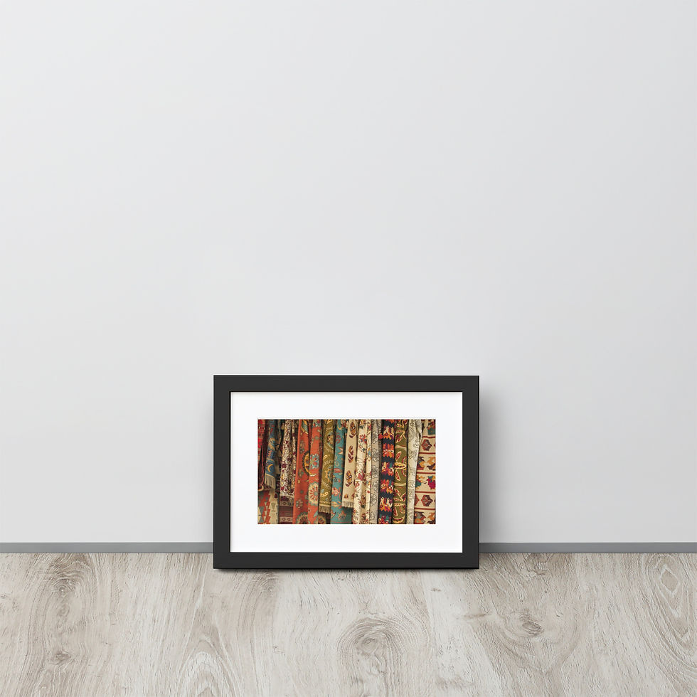 Close-up photograph of multiple vibrant, patterned Bohemian and Turkish textiles hanging side-by-side.