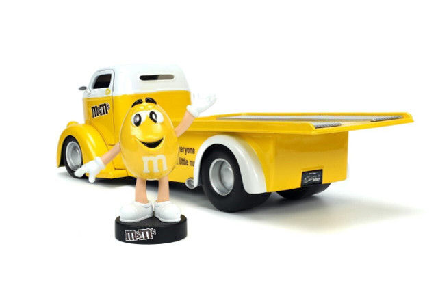 Thumbnail: 1947 FORD COE FLATBED TOW TRUCK WITH YELLOW M & M FIGURE 1/24 SCALE DIECAST CAR