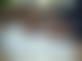 Client signing official documents on a clipboard in a professional office setting, representing title, escrow, and notary services.