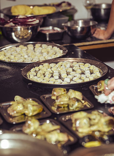 Buffet station with handmade gnocchi and plated vegetable bites – gourmet catering setup