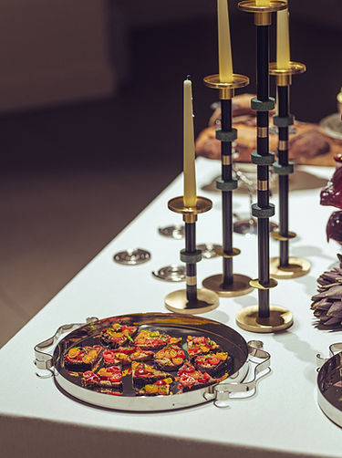 Tapas-style gourmet vegetables and candelabras – curated table art for immersive experience