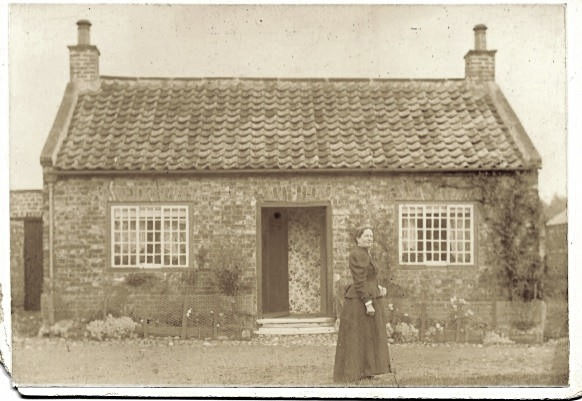 Miss Helen Metcalfe in front of Cottage - Dolls House