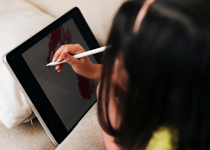 close-up-girl-drawing-her-tablet-with-pen.jpg