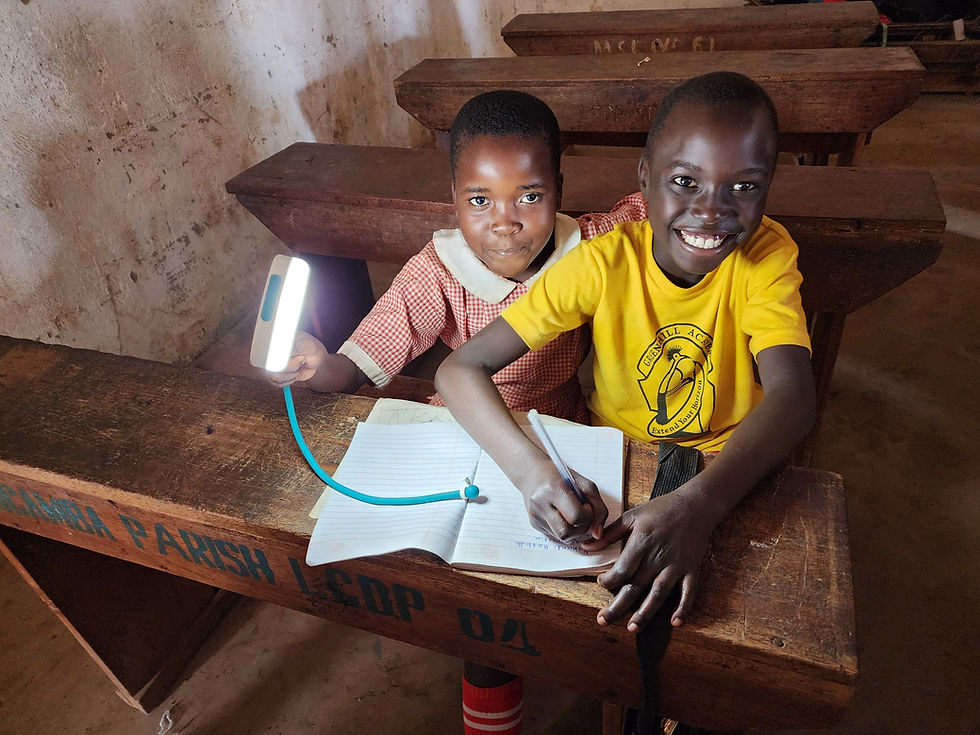 Kids in Uganda enjoying their solar lights