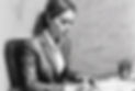 black and white charcoal sketch of a female professional in a suite while concentrating on