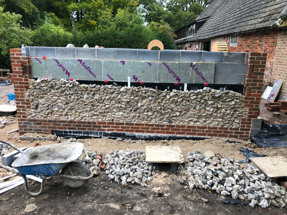 red brickwork and locally sourced flint stone infill