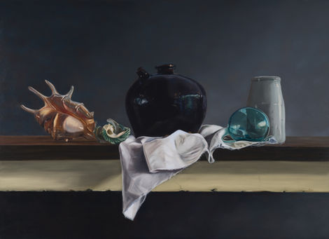 still life oil painting of an antique black ceramic pot, sea shells, a glass float and small white jug on folded white drapery and a dusty blue background