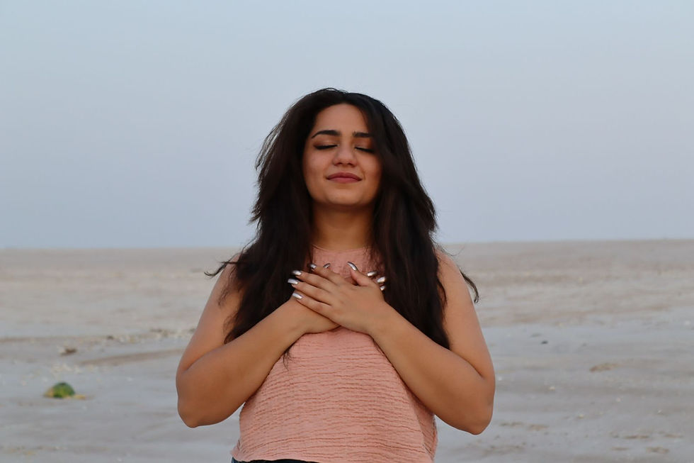 Aaliyah with hands on heart