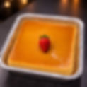 Square flan in foil pan with strawberry