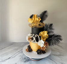black and gold masquerade cake with feathers and mask for a womans 50th birthday Sydney cakes Sutherland shire cakes gluten free cake