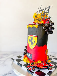 Ferrari cake with Ferrari logo with black and white checkers and red black and yellow colours Ferrari car features on the side Sydney cakes Sutherland shire cakes gluten free cake